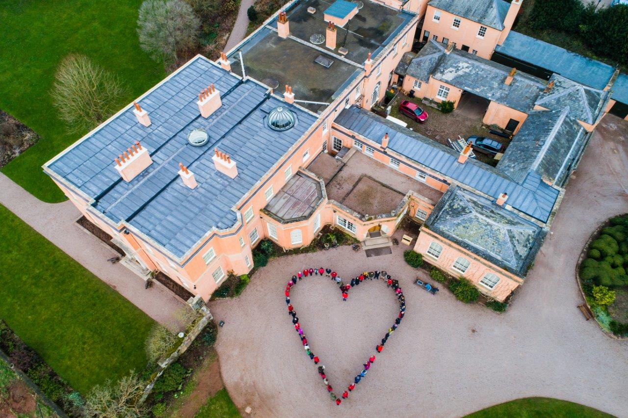 Killerton House aerial shot with volunteers in heart shape